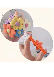 Close-up of high elasticity colorful flower hair ties showing stretchable fabric texture