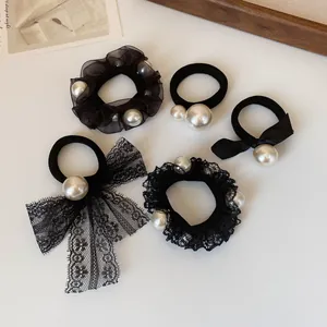 5-piece set of minimalist black hair scrunchies with white pearls and mesh bows