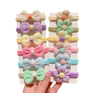 12-piece baby headband set with fabric bows and flowers in soft pastel macarons colors