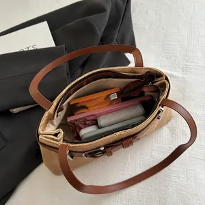Top view of spacious khaki shoulder bag interior showing high capacity and zip closure