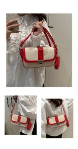 Detail of red and beige woven saddle bag with silver buckle and mini round coin purse