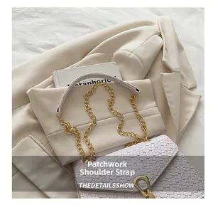 Close-up of light purple woven bag with golden buckle and spliced chain strap detail