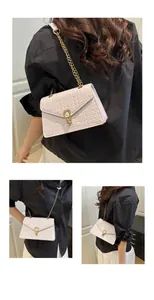 Detail of light pink woven PU leather bag with golden chain strap and U-shaped metal lock
