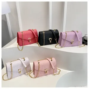 Close-up of woven texture PU leather bags with gold chain straps in five vibrant colors