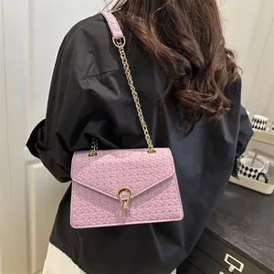 Purple woven PU leather crossbody bag with gold chain strap and metallic buckle
