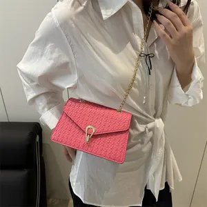 Hot pink woven PU leather crossbody bag with gold U-shaped buckle and chain strap