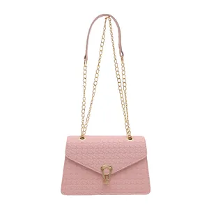 Pink woven PU leather crossbody bag with gold U-shaped lock and chain strap