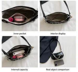 Detail view showing black glossy underarm bag interior pockets and size comparison