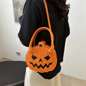 Orange Halloween pumpkin crossbody bag with spider web pattern and Jack-o'-lantern face