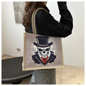 Detailed view of canvas tote bag with gentleman skeleton print and rope handles