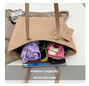 Internal capacity of khaki woven tote bag showing space for tablet, umbrella and wallet