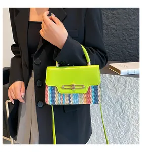 Detail of color-block crossbody bag featuring lime green flap and woven stripe texture