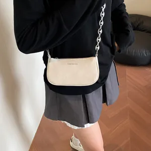 Chic ivory baguette bag with crinkled leather finish and chunky chain strap for women