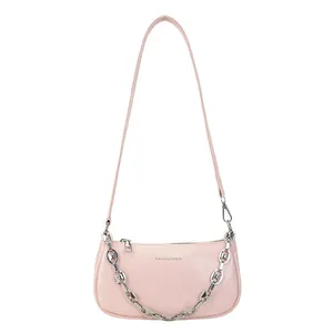 Pink faux leather baguette bag with silver chain and shoulder strap on white background