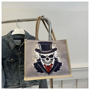 Detail of canvas tote bag featuring skull gentleman print and textured linen handles