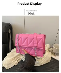 Detailed view of pink quilted chain crossbody bag with silver hardware and leather trim