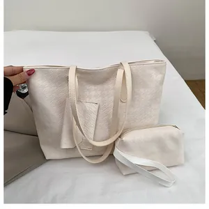 Close-up of beige woven texture tote bag set with detachable pouches for travel