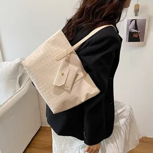 Beige woven texture tote bag set with matching pouch and golden chain for daily commute