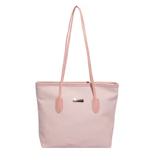 Pink woven texture tote bag with golden metal plaque and double shoulder straps