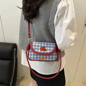 Chic blue and white plaid crossbody bag with red trim and cute apple embroidery