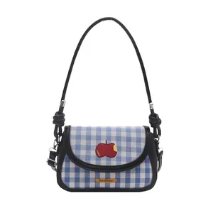 Blue and white checkered mini saddle bag with red apple embroidery and knot strap