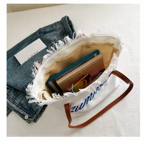 Spacious canvas tote bag with Summer print, brown leather straps and fringed edges