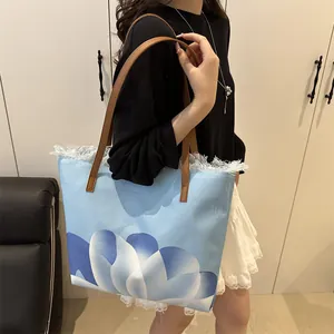 Bolso tote grande de lona azul con estampados florales y borlas para mujer moda
