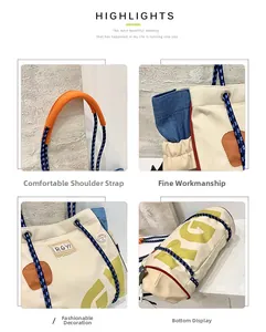Detail of beige canvas tote bag showing braided rope handle and orange shoulder protector