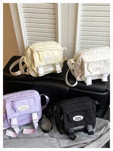 Collection of minimalist nylon crossbody bags in beige, white, purple, and black colors