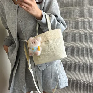 Chic cream canvas tote bag with pleated texture and cute bunny pendant for women