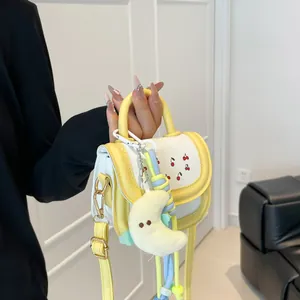 Mini yellow cherry crossbody bag for girls with cute moon plush charm decoration