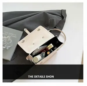 Top view showing internal capacity of the minimalist beige square crossbody bag with magnetic buckle