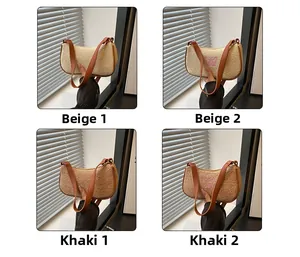 Detail von Strohtaschen in Beige und Khaki mit Lederriemen und Stickerei