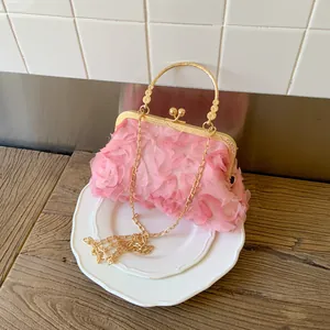 Elegant pink evening clutch bag with 3D fabric roses and golden round metal handle