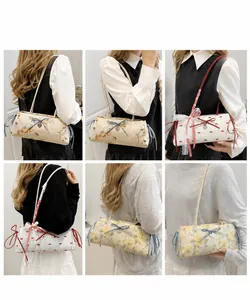Detailed views of printed pleated tote bags featuring floral patterns and heart charms