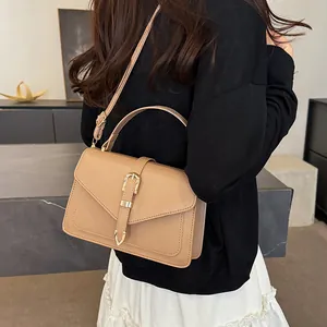 Minimalist khaki PU leather crossbody bag with gold buckle and adjustable strap