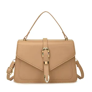 Minimalist khaki leather crossbody flap bag with golden buckle and top handle