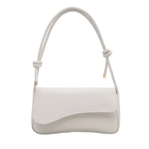 Elegant off-white minimalist underarm bag with asymmetrical flap and knotted strap