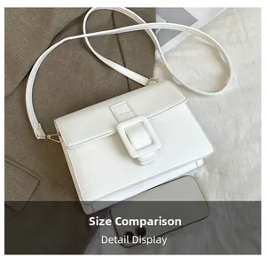 Size comparison of white PU leather square crossbody bag with large buckle and a smartphone