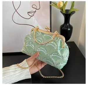 Mint green sequined evening bag with mesh pleats and a vintage gold kiss-lock frame