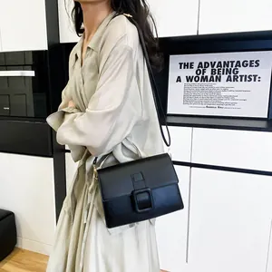 Minimalist black leather crossbody square bag for women with elegant square buckle detail