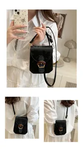 Close-up of vintage black velvet square bag featuring unique wood-texture horseshoe buckle