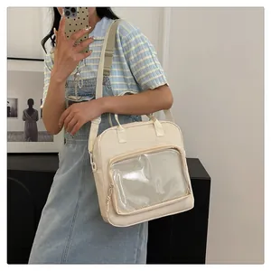Detail view of cream white ita bag with clear window and mesh lining for display
