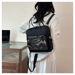 Detail of black multi-use transparent PVC ita bag shown in a daily lifestyle campus setting