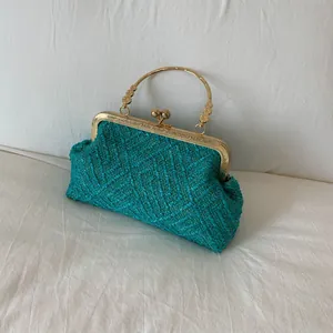 Retro woven peacock blue evening shell bag with golden metal frame and handle