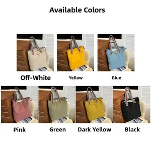 Detailed view of colorful nylon tote bags featuring striped handles and drawstring closure
