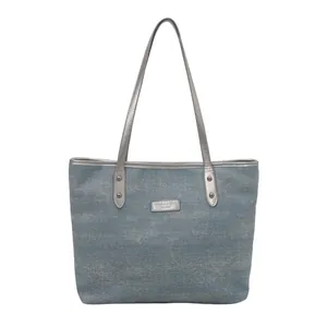 Fashionable blue denim tote bag with silver leather handles and large capacity