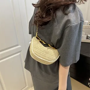 Chic beige woven half-moon handbag with wavy gold handle and metal chain shoulder strap