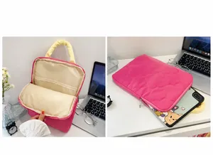 Internal view of pink quilted heart laptop bag with yellow handles and storage slots