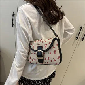 Chic cream canvas shoulder bag with red cherry prints and black leather trim for women